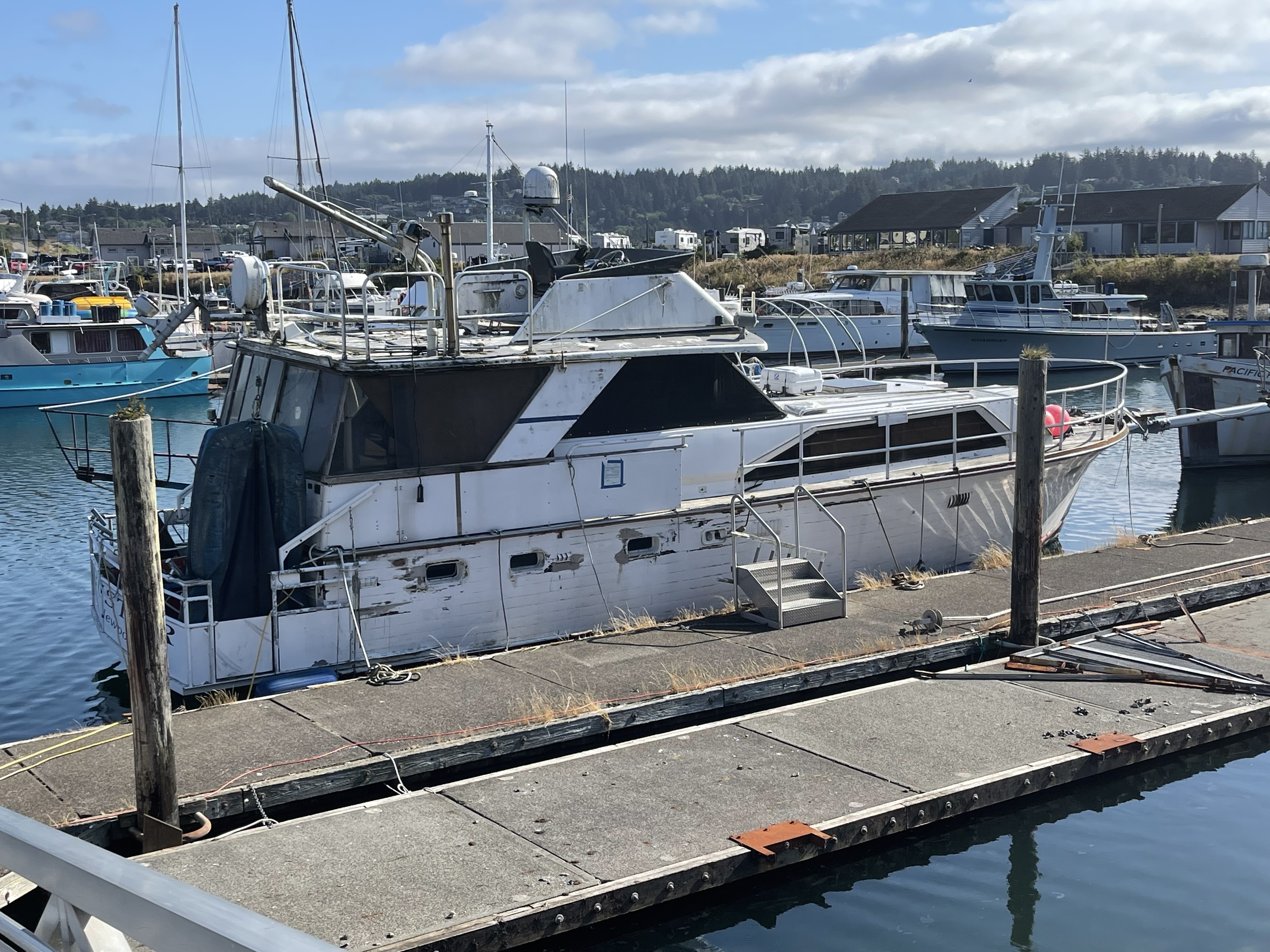 An abandoned derelict vessel at imminent risk of sinking at the Port of Newport, Oregon, will be removed under a groundbreaking removal program. (credit Dorothy Diehl, Oregon Dept. of State Lands)